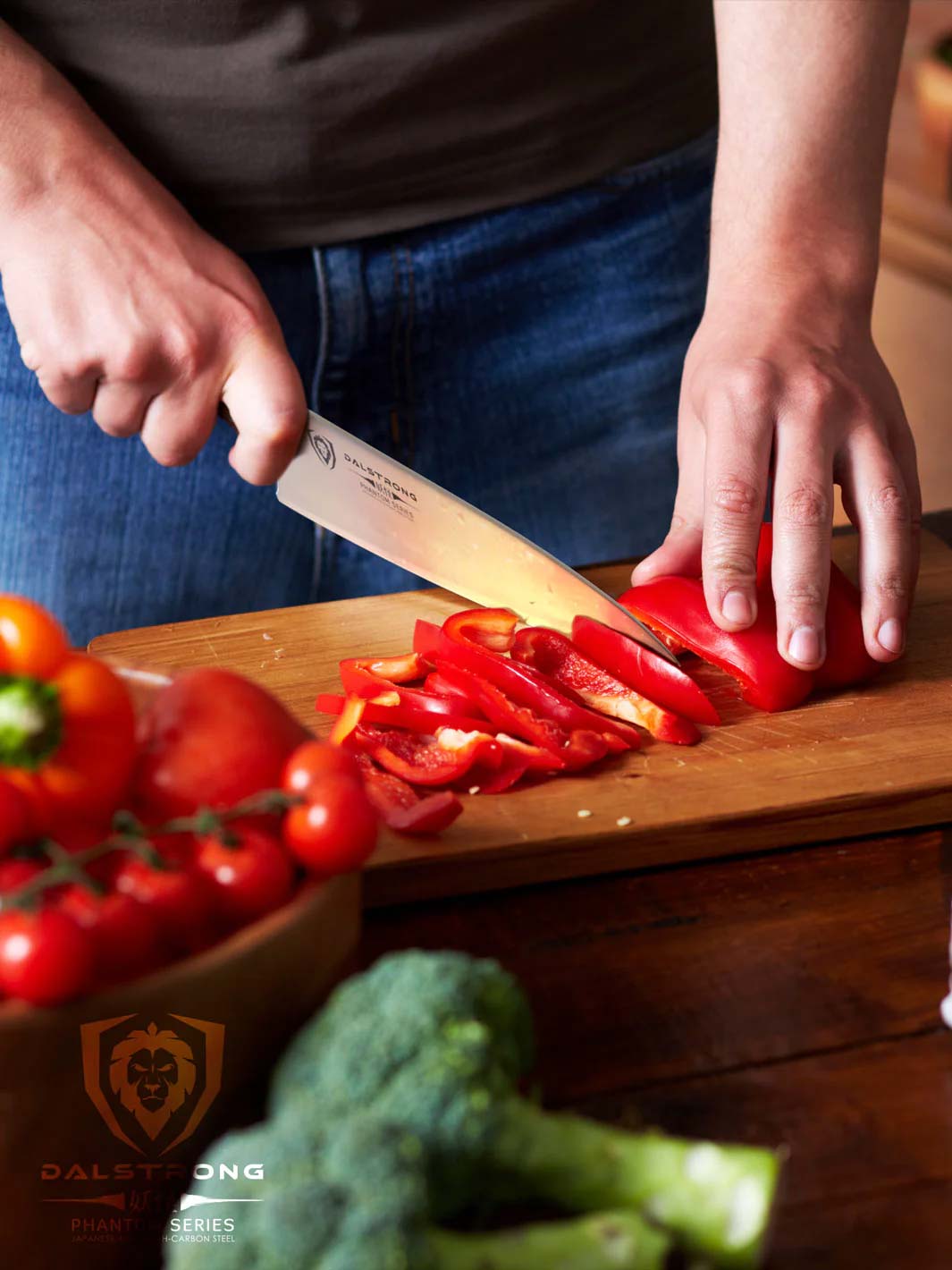 Dalstrong phantom series 8 inch chef knife with pakka wood handle and sliced red bell peppers on a cutting board.