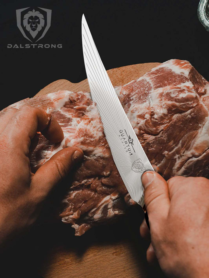 Dalstrong quantum 1 series 6.5 inch curved boning knife with dragon skin handle and a huge cut of meat.