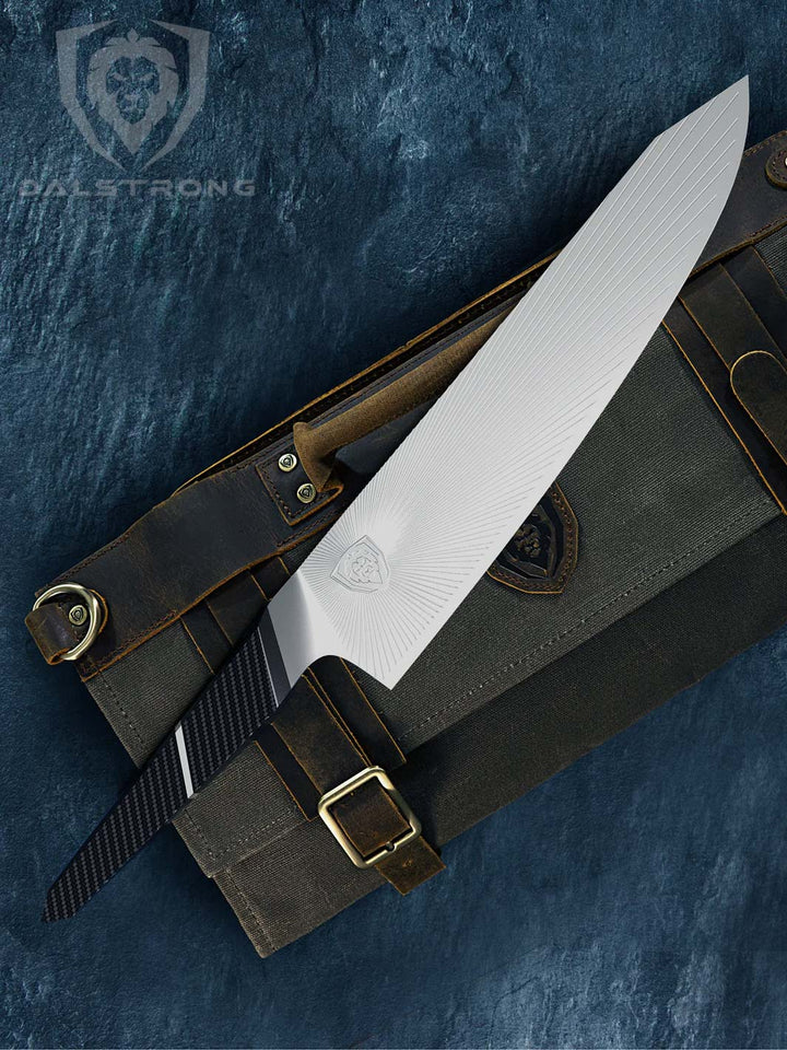 Dalstrong quantum 1 series 9.5 inch chef knife with dragon skin handle on top of a dalstrong knife bag.