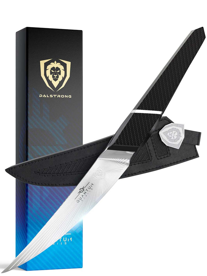 Dalstrong quantum 1 series 6.5 inch curved boning knife with dragon skin handle in front of it's premium packaging.