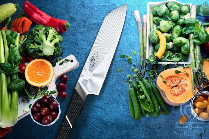 Dalstrong quantum 1 series 7 inch santoku knife with dragon skin handle surrounded by vegetables.