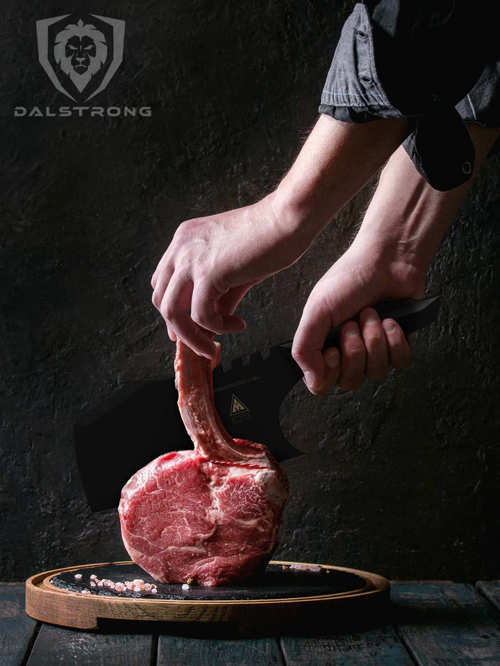 Dalstrong shadow black series 9 inch obliterator cleaver knife with a huge cut of meat on a cutting board.