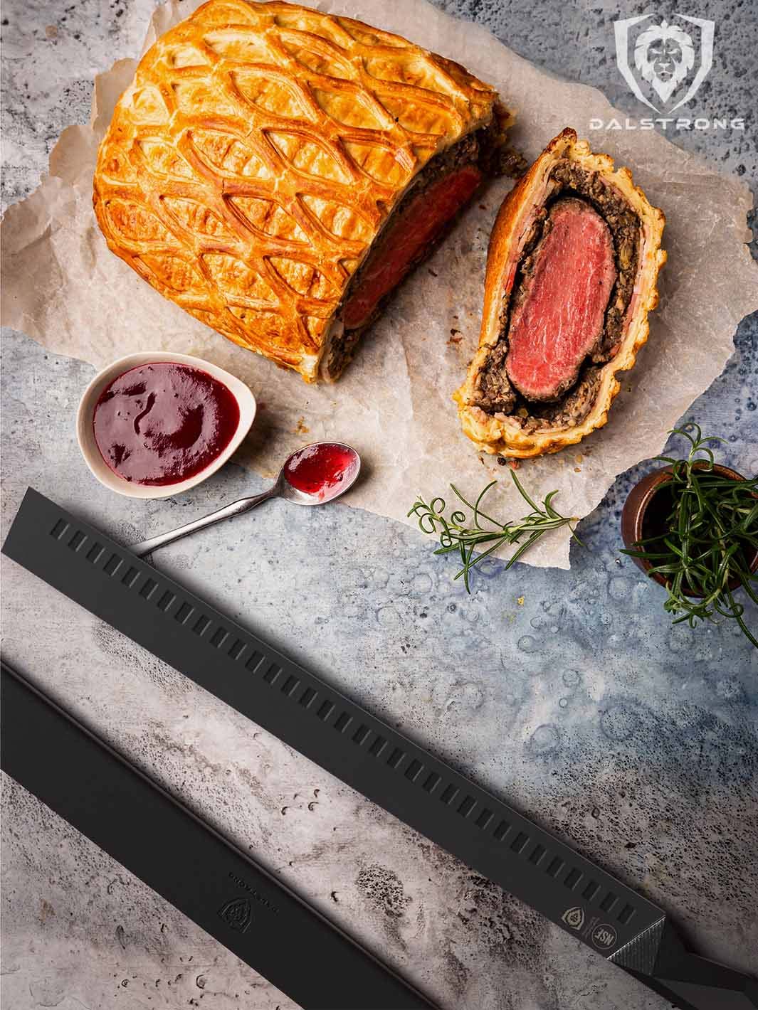 Dalstrong shadow black series 14 inch slicer knife with a sliced beef wellington.