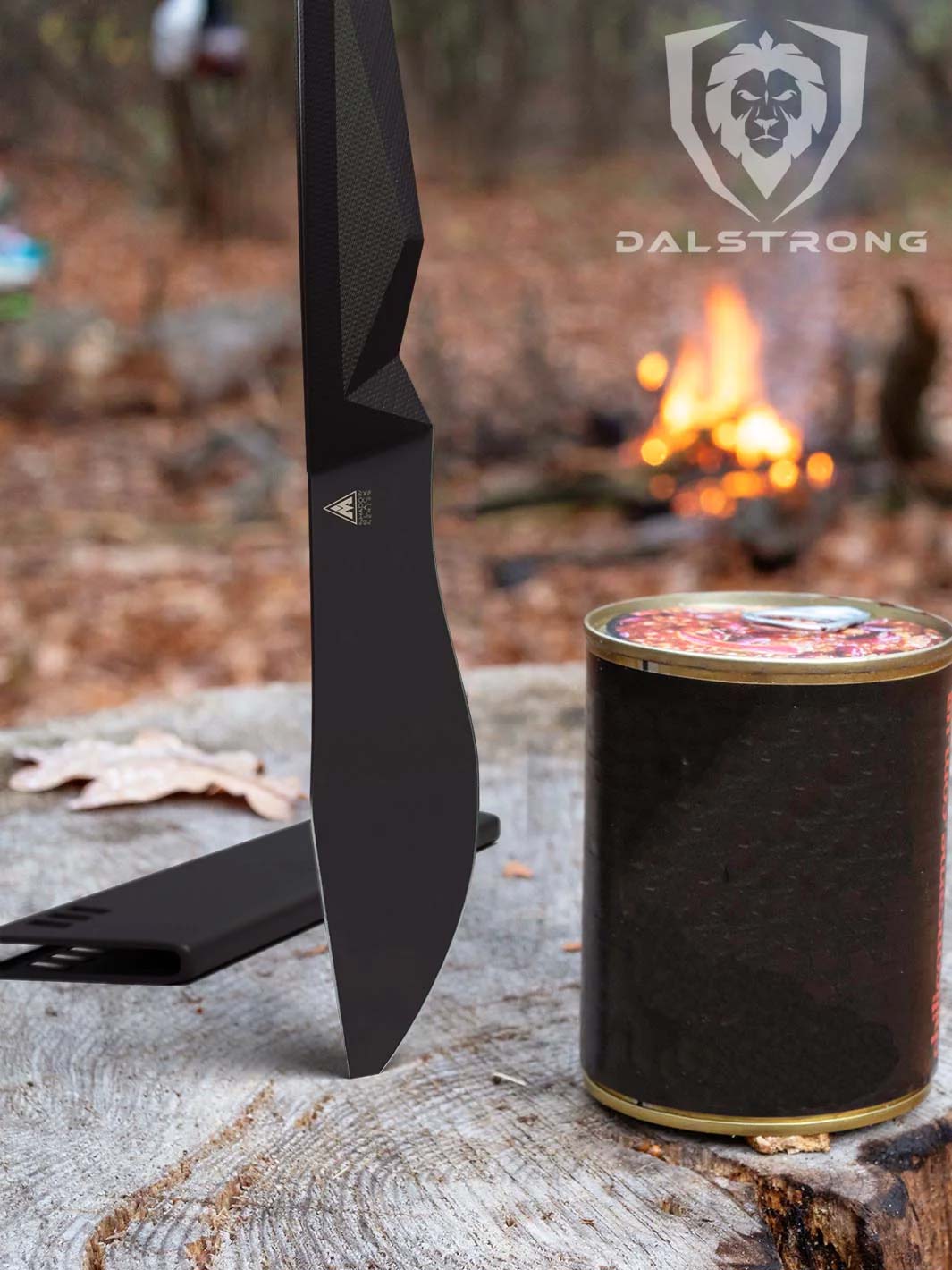 Dalstrong shadow black series 7 inch barong knife beside a black can on a log.