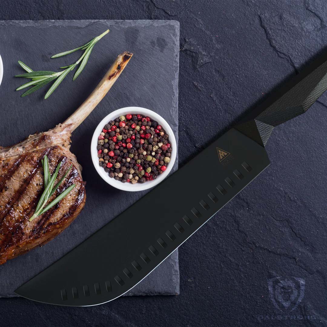 Dalstrong shadow black series 10 inch bull nose butcher knife with black sheath beside a huge cut of steak on a cutting board.