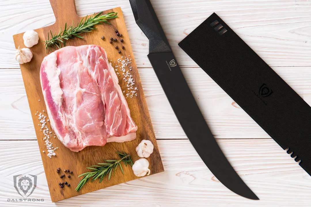 Dalstrong shadow black series 10 inch butcher knife with black sheath and a large cut of meat on a cutting board.