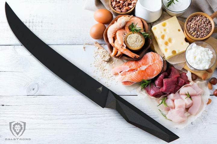 Dalstrong shadow black series 10 inch butcher knife with fish fillet, prawns and small cuts of meat at the side.