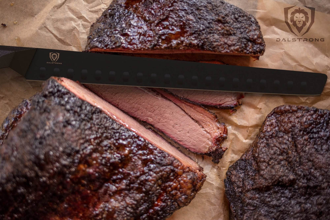 Dalstrong shadow black series 12 inch slicer knife with slices of smoked brisket.