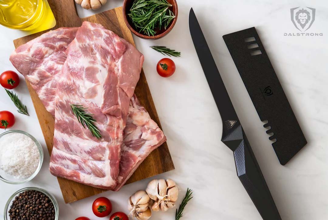 Dalstrong shadow black series 6 inch straight boning knife with two racks of ribs at the side.