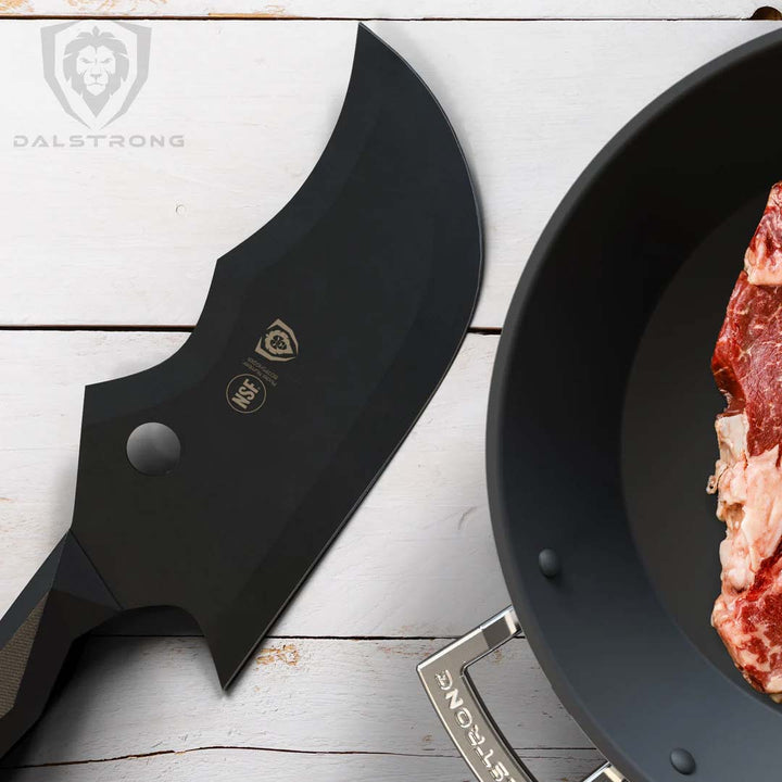 Dalstrong shadow black series 9 inch cleaver knife with a cut of meat on the side.