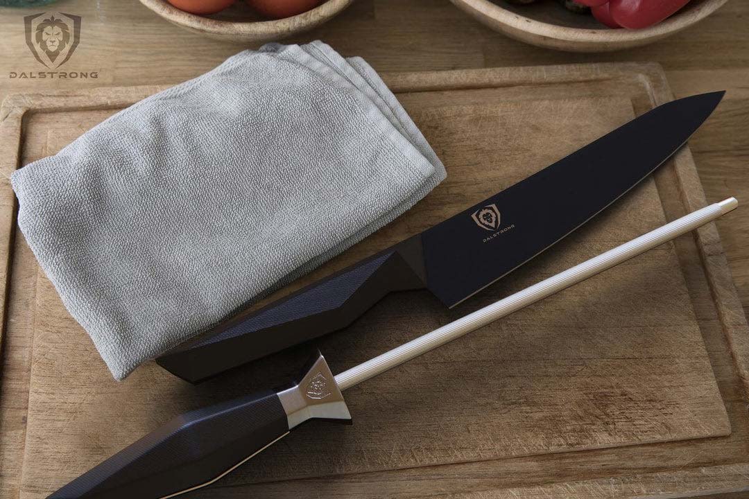 Dalstrong shadow black series 9 inch honing rod with shadow black series chef knife on a cutting board.