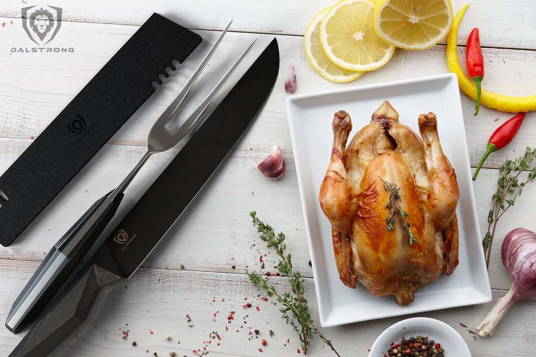 Dalstrong shadow black series 9 inch carving and fork set with black sheath beside a roasted whole chicken.