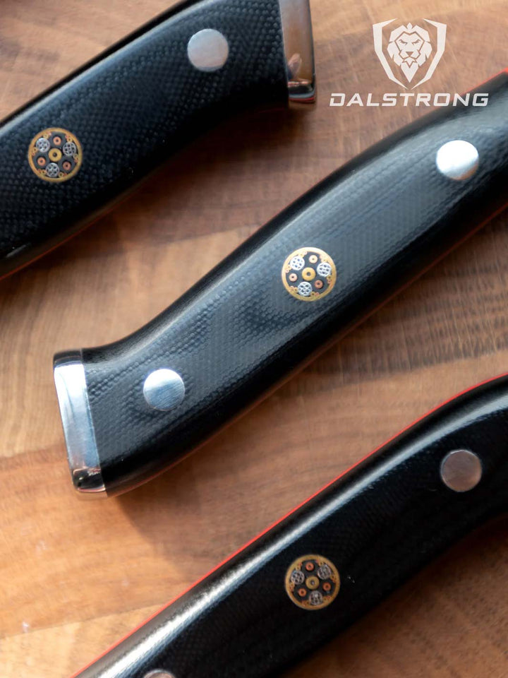 Dalstrong shogun series cheese knife set showcasing it's ergonomic black handles.