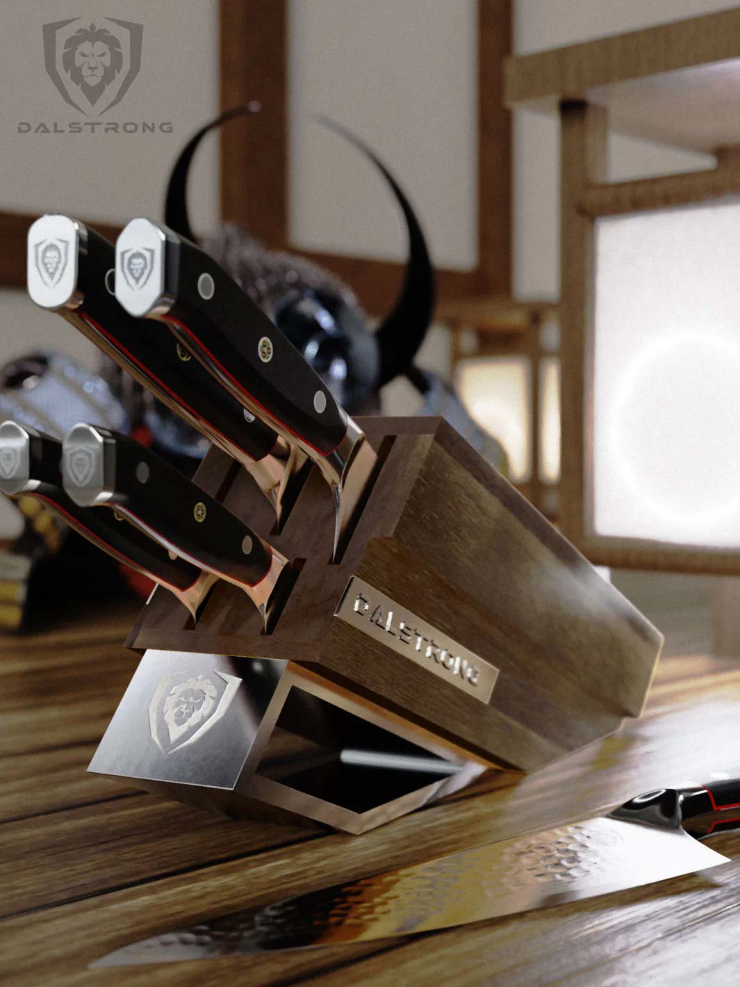 Dalstrong shogun series 5 piece knife block set with black handles on top of a wooden table.