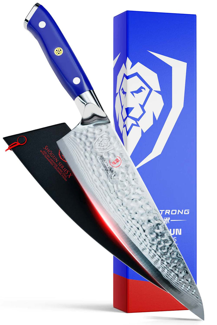 Dalstrong shogun series 8 inch chef knife with blue handle in front of it's beautiful packaging.