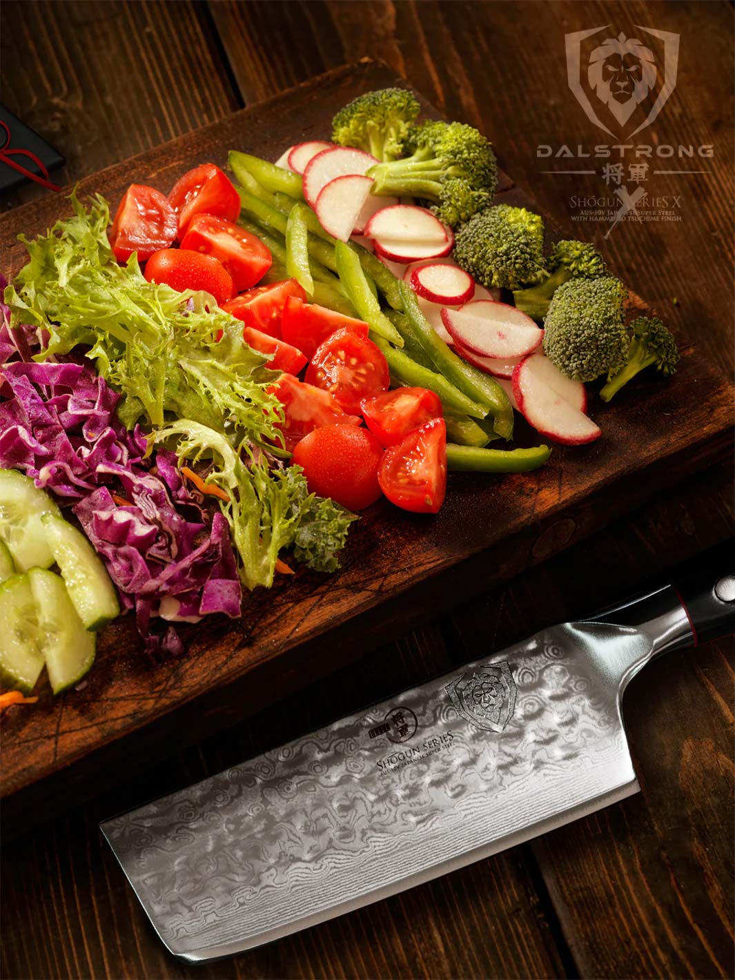 Dalstrong shogun series 6 inch nakiri knife with black handle and chopped vegetables on a wooden board.