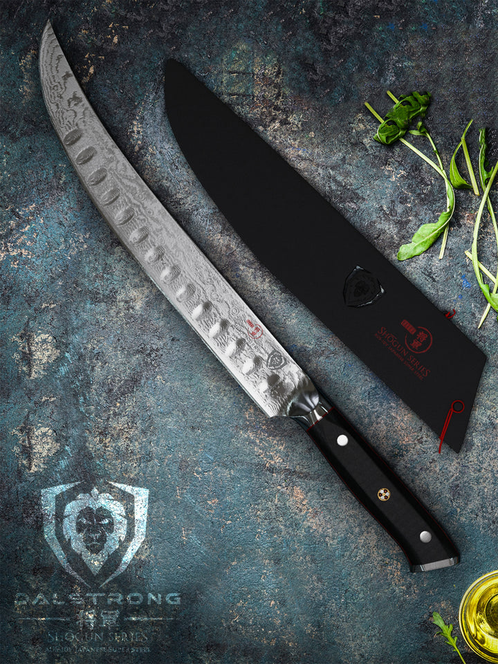 Dalstrong shogun series 10 inch butchers knife with black handle on a rough surface.