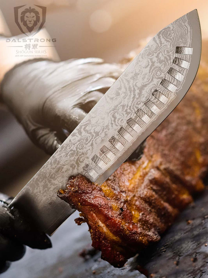 Dalstrong shogun series 8 inch bull nose butcher knife slicing through a rack of rib.