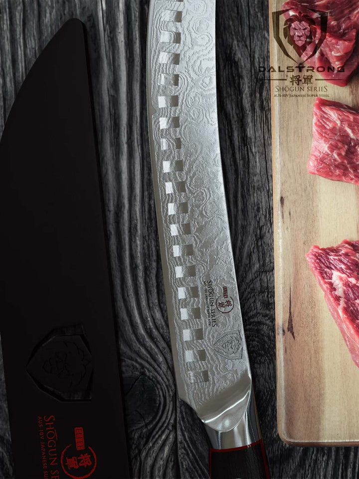 Dalstrong shogun series 8 inch butcher knife with black handle and sheath beside slices of meat.