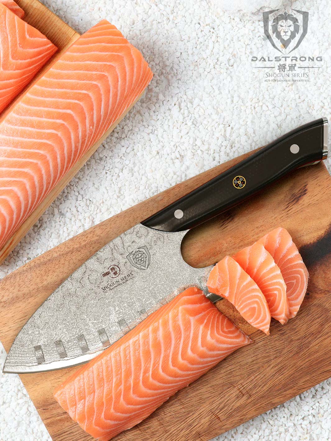Dalstrong shogun series 8 inch guardian chef knife with black handle and slices of fish meat on a wooden board.