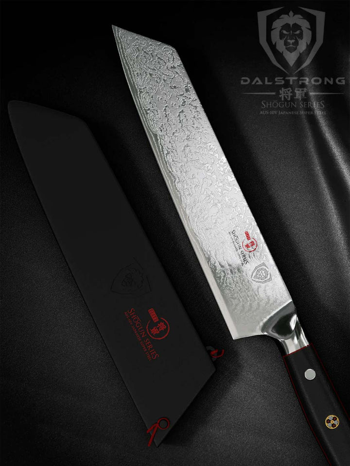 Dalstrong shogun series 8.5 inch kiritsuke knife with black handle and sheath on a black cloth.