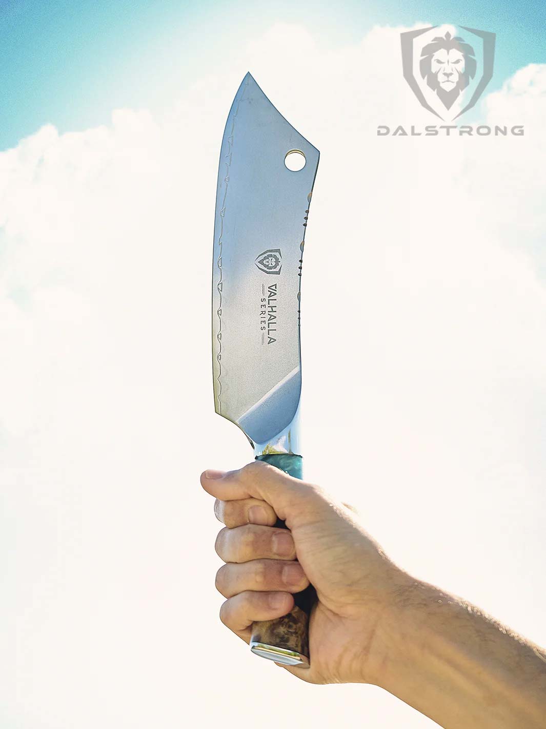 A hand holding the Dalstrong valhalla series 8 inch crixus knife with wooden handle.