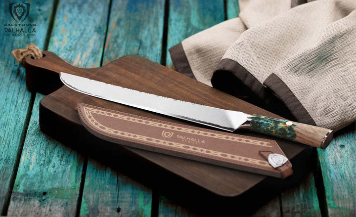 Dalstrong valhalla series 12 inch slicer knife with wooden handle and sheath on top of a cutting board.