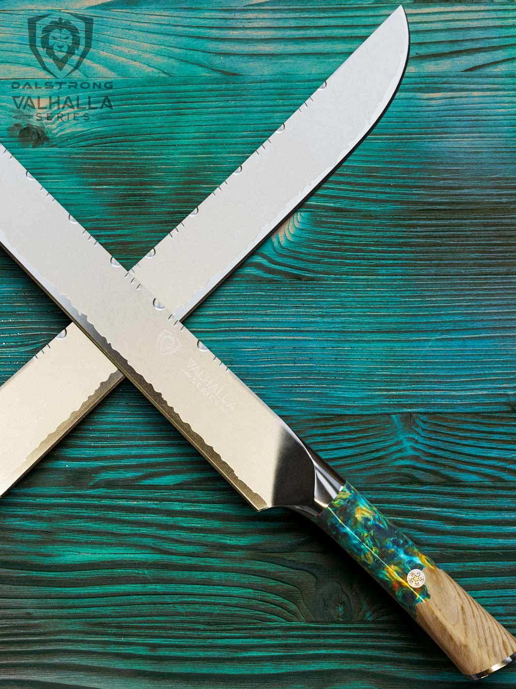 Dalstrong valhalla series 12 inch slicer knife with wooden handle on top of a wooden table.