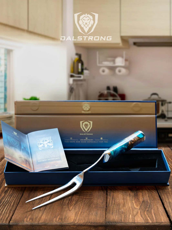 Dalstrong valhalla series 7.7 inch meat fork with wooden handle outside it's premium packaging.