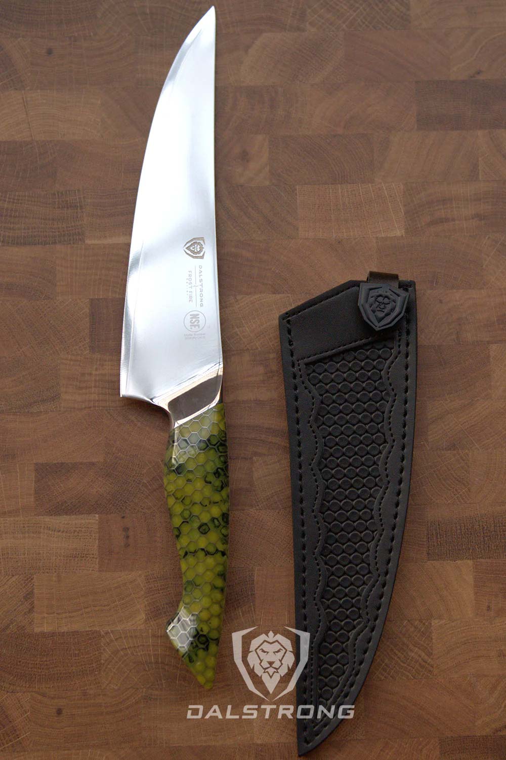 Dalstrong frost fire series 8 inch chef knife with dragon skin handle and black sheath inside on a wooden board.
