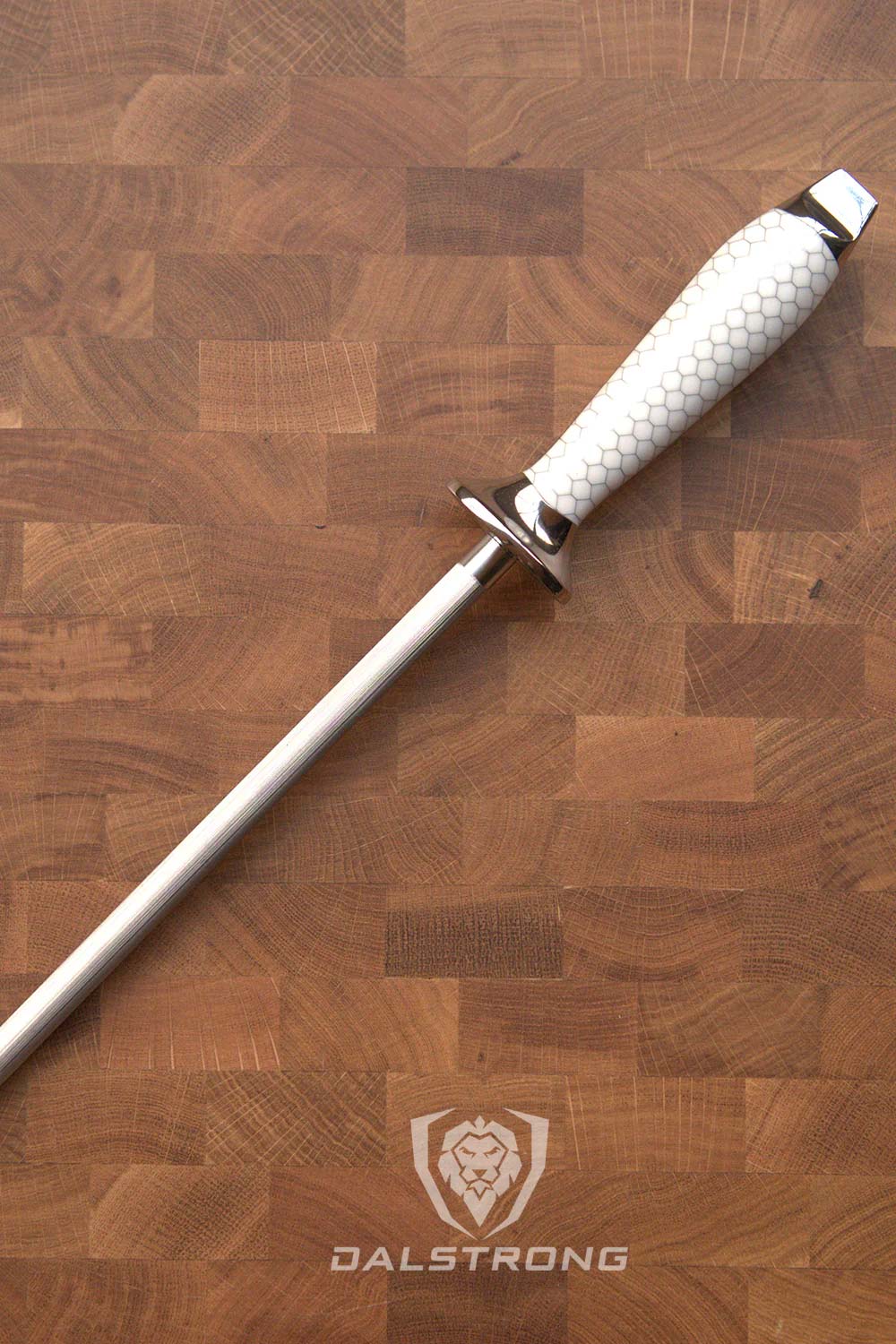 Dalstrong frost fire series 10 inch honing rod with white honeycomb handle on a cutting board.