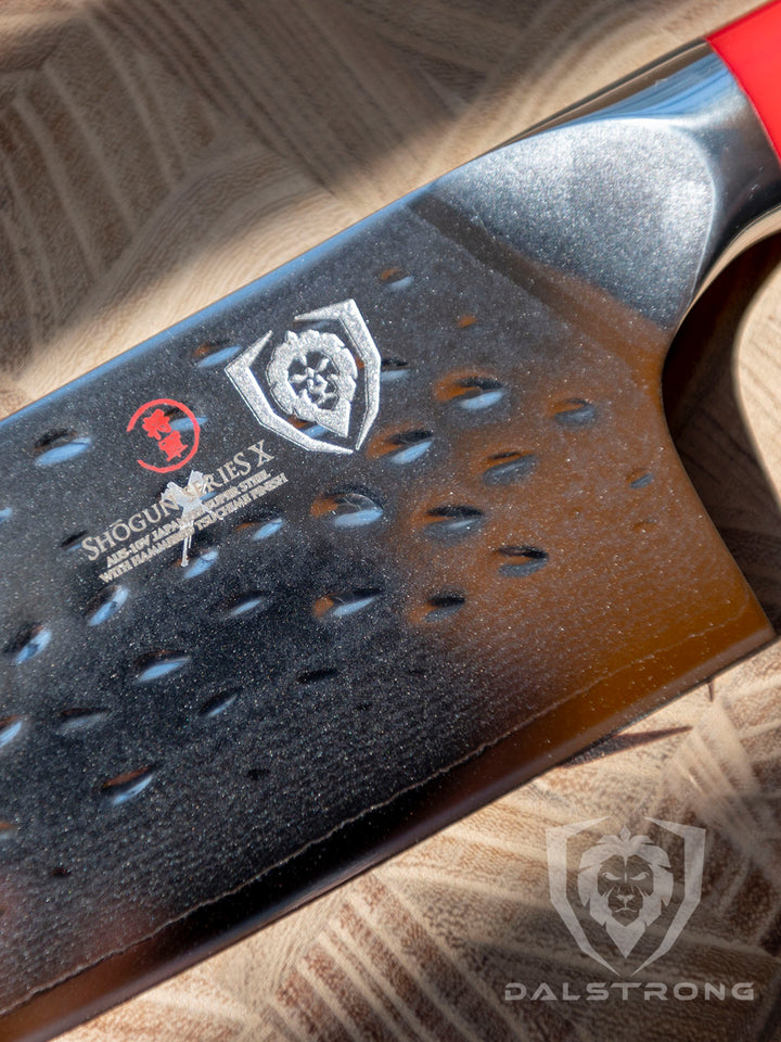 Dalstrong shogun series 6 inch nakiri knife with crimson red handle showcasing the blade and Dalstrong logo.