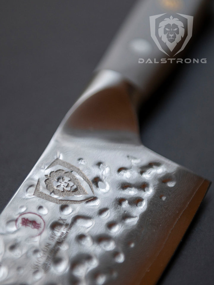 Dalstrong shogun series 8 inch chef knife with smokey gray handle featuring it's blade and dalstrong logo.