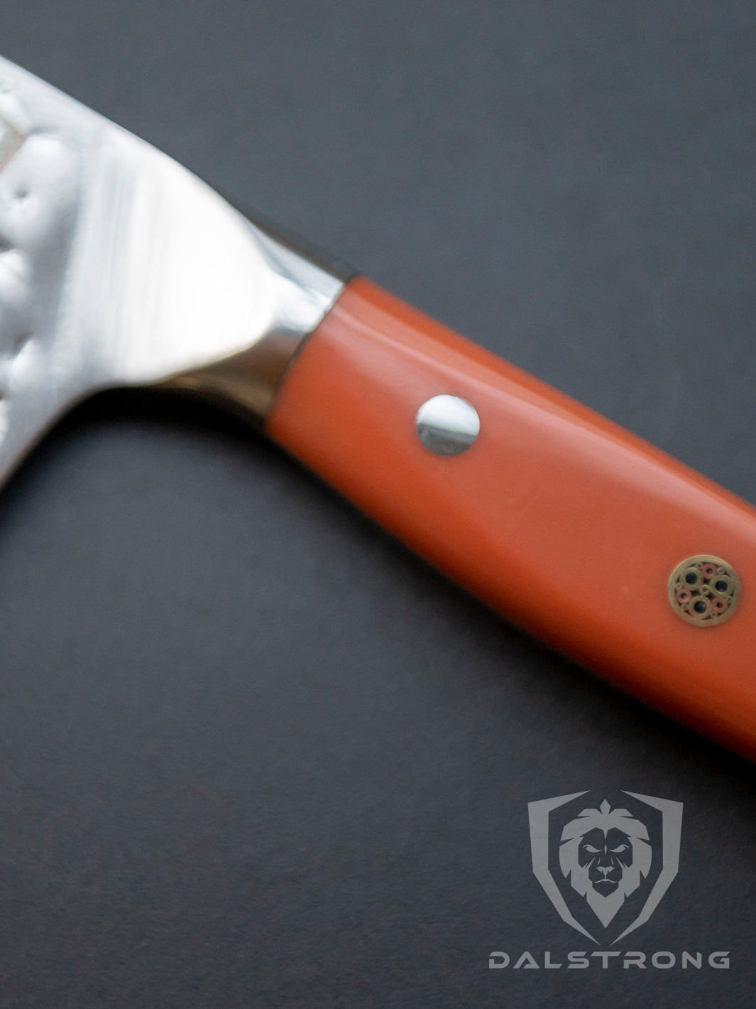 Dalstrong shogun series 8 inch chef knife showcasing it's ergonomic flame orange handle and tang.