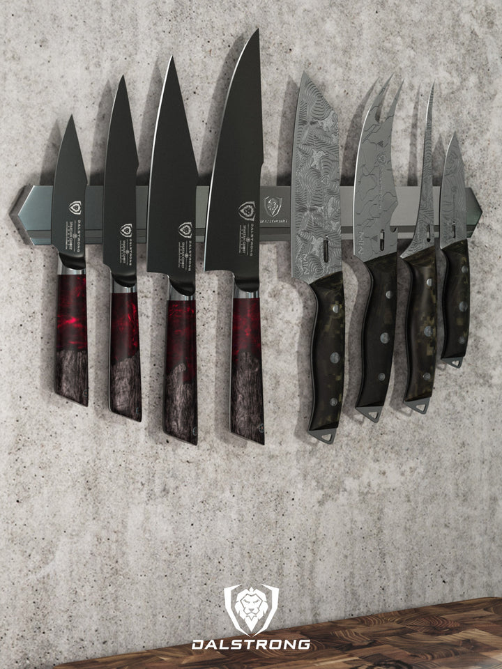 Dalstrong magnetic bar stainless wall knife holder with knives on it.