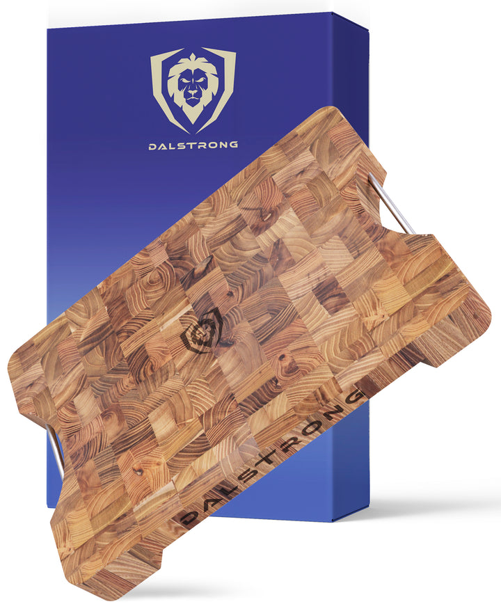 Dalstrong lionswood teak cutting board medium size in front of it's premium packaging.