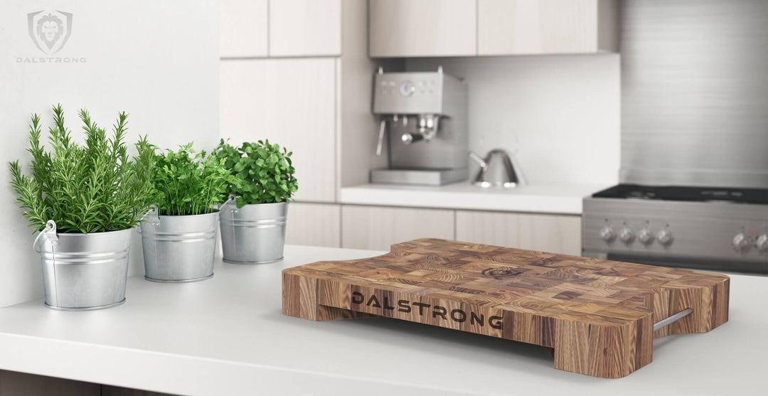 Dalstrong lionswood teak cutting board medium size on a kitchen table.