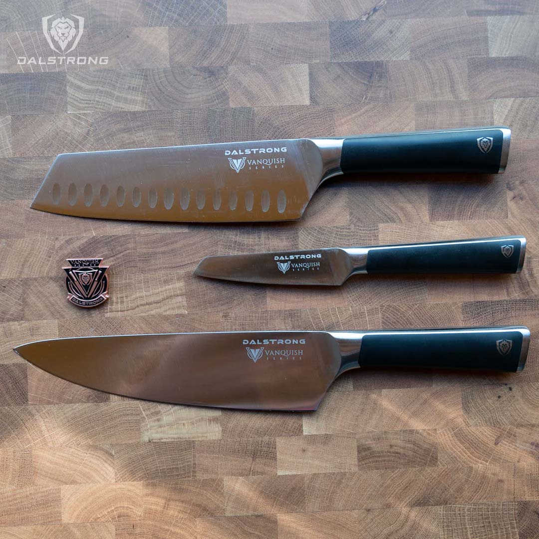 Dalstrong vanquish series 3 piece knife set with black handles and pin.