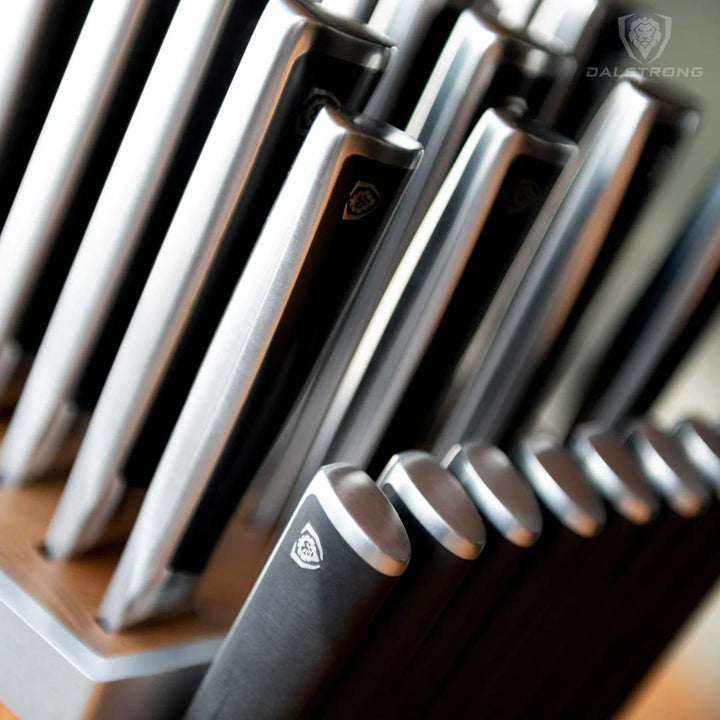 Dalstrong vanquish series 24 piece knife set featuring it's ergonomic handles.
